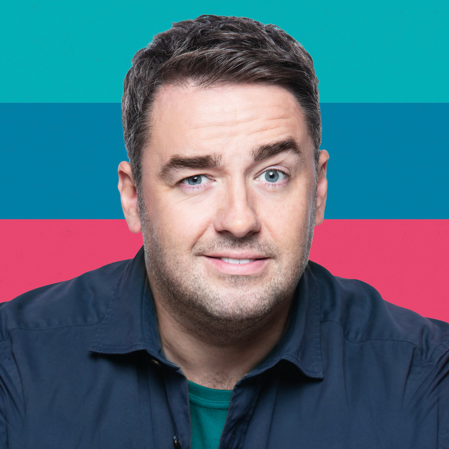 A man, Jason Manford in front of a colourful background