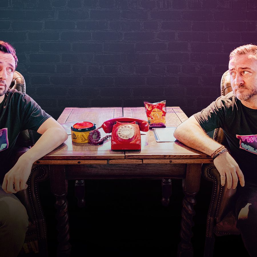 Two Pints podcast hosts, Will Mellor and Ralf Little, are seated at a table